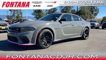 2023 Dodge Charger Scat Pack Widebody in a Destroyer Gray exterior color and Blackinterior. Fontana Chrysler Dodge Jeep RAM (909) 675-1186 fontanacdjr.com 