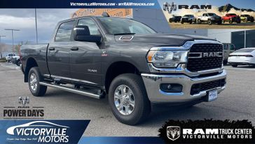 2024 RAM 2500 Big Horn Crew Cab 4x4 6'4' Box in a Granite Crystal Metallic Clear Coat exterior color. Victorville Motors Chrysler Jeep Dodge RAM Fiat 760-513-6916 victorvillemotors.com 