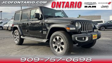 2023 Jeep Wrangler Sahara in a Black Clear Coat exterior color and Blackinterior. Ontario Auto Center ontarioautocenter.com 