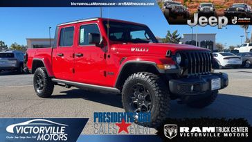 2023 Jeep Gladiator Willys 4x4 in a Firecracker Red Clear Coat exterior color and Blackinterior. Victorville Motors Chrysler Jeep Dodge RAM Fiat 760-513-6916 victorvillemotors.com 