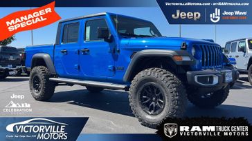 2023 Jeep Gladiator Sport S 4x4 in a Hydro Blue Pearl Coat exterior color and Blackinterior. Victorville Motors Chrysler Jeep Dodge RAM Fiat 760-513-6916 victorvillemotors.com 