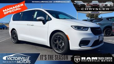 2023 Chrysler Pacifica Plug-in Hybrid Touring L in a Bright White Clear Coat exterior color and Blackinterior. Victorville Motors Chrysler Jeep Dodge RAM Fiat 760-513-6916 victorvillemotors.com 