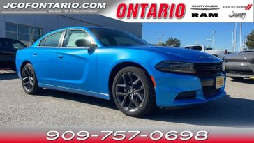 2023 Dodge Charger SXT in a B5 Blue Pearl Coat exterior color and Blackinterior. Ontario Auto Center ontarioautocenter.com 