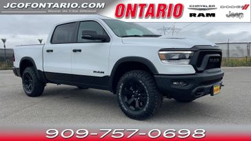 2024 RAM 1500 Rebel Crew Cab 4x4 5'7' Box in a Bright White Clear Coat exterior color and Red/Blackinterior. Jeep Chrysler Dodge RAM FIAT of Ontario 909-757-0698 jcofontario.com 