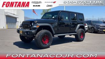 2023 Jeep Wrangler  Sport S 4x4 in a Black Clear Coat exterior color and Blackinterior. Fontana Chrysler Dodge Jeep RAM (909) 675-1186 fontanacdjr.com 