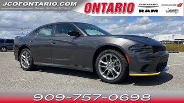 2023 Dodge Charger Gt Awd in a Granite exterior color and Blackinterior. Jeep Chrysler Dodge RAM FIAT of Ontario 909-757-0698 jcofontario.com 