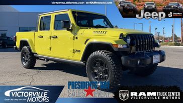 2023 Jeep Gladiator Willys 4x4 in a High Velocity Clear Coat exterior color and Blackinterior. Victorville Motors Chrysler Jeep Dodge RAM Fiat 760-513-6916 victorvillemotors.com 