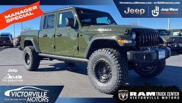 2023 Jeep Gladiator Willys 4x4 in a Sarge Green Clear Coat exterior color and Blackinterior. Victorville Motors Chrysler Jeep Dodge RAM Fiat 760-513-6916 victorvillemotors.com 