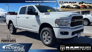 2024 RAM 2500 Big Horn Crew Cab 4x4 6'4' Box in a Bright White Clear Coat exterior color. Victorville Motors Chrysler Jeep Dodge RAM Fiat 760-513-6916 victorvillemotors.com 