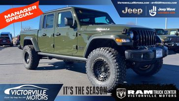 2023 Jeep Gladiator Willys 4x4 in a Sarge Green Clear Coat exterior color and Blackinterior. Victorville Motors Chrysler Jeep Dodge RAM Fiat 760-513-6916 victorvillemotors.com 