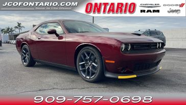 2023 Dodge Challenger GT in a Octane Red Pearl Coat exterior color and Blackinterior. Ontario Auto Center ontarioautocenter.com 