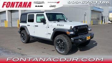 2023 Jeep Wrangler  Willys 4x4 in a Bright White Clear Coat exterior color and Blackinterior. Fontana Chrysler Dodge Jeep RAM (909) 675-1186 fontanacdjr.com 