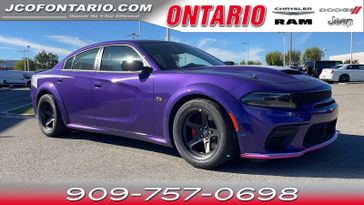 2023 Dodge Charger Scat Pack Widebody in a Plum Crazy Pearl Coat exterior color and Thx9interior. Ontario Auto Center ontarioautocenter.com 