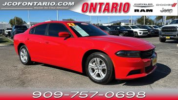 2022 Dodge Charger SXT in a Torred Clear Coat exterior color and Blackinterior. Jeep Chrysler Dodge RAM FIAT of Ontario 909-757-0698 jcofontario.com 