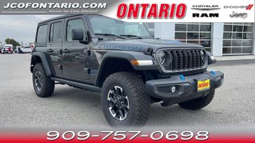 2024 Jeep Wrangler 4xE Rubicon in a Granite Crystal Metallic Clear Coat exterior color and Blackinterior. Ontario Auto Center ontarioautocenter.com 