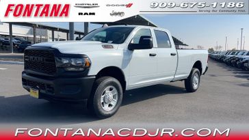 2024 RAM 3500 Tradesman in a Bright White Clear Coat exterior color and Diesel Gray/Blackinterior. Fontana Chrysler Dodge Jeep RAM (909) 675-1186 fontanacdjr.com 