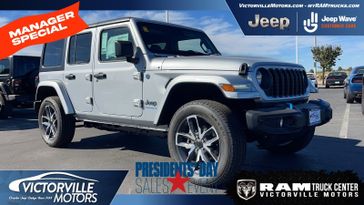 2024 Jeep Wrangler  Sport S 4xe in a Silver Zynith Clear Coat exterior color and Blackinterior. Victorville Motors Chrysler Jeep Dodge RAM Fiat 760-513-6916 victorvillemotors.com 