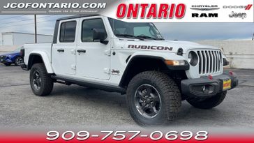 2023 Jeep Gladiator Rubicon 4x4 in a Bright White Clear Coat exterior color and Blackinterior. Jeep Chrysler Dodge RAM FIAT of Ontario 909-757-0698 jcofontario.com 