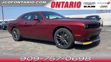 2023 Dodge Challenger GT in a Octane Red Pearl Coat exterior color and Blackinterior. Ontario Auto Center ontarioautocenter.com 