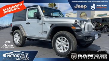 2023 Jeep Wrangler  Sport S 4x4 in a Silver Zynith Clear Coat exterior color and Blackinterior. Victorville Motors Chrysler Jeep Dodge RAM Fiat 760-513-6916 victorvillemotors.com 