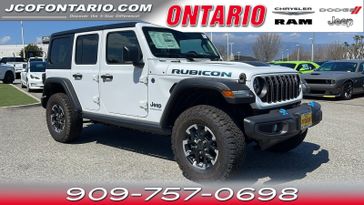 2024 Jeep Wrangler 4xE Rubicon in a Bright White Clear Coat exterior color and Blackinterior. Ontario Auto Center ontarioautocenter.com 