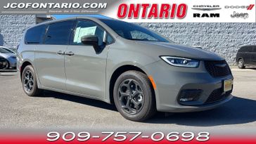 2023 Chrysler Pacifica Hybrid Touring L in a Ceramic Gray Clear Coat exterior color and Blackinterior. Ontario Auto Center ontarioautocenter.com 