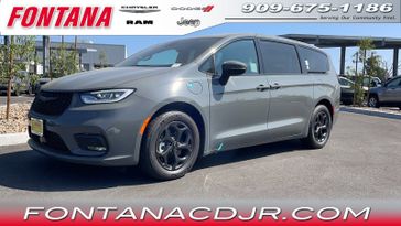 2023 Chrysler Pacifica Plug-in Hybrid Touring L in a Ceramic Gray Clear Coat exterior color and Blackinterior. Fontana Chrysler Dodge Jeep RAM (909) 675-1186 fontanacdjr.com 