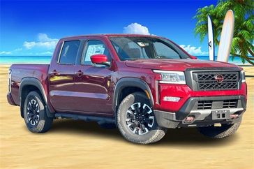 2023 Nissan Frontier PRO-X in a Cardinal Red Metallic Tri Coat exterior color and Steelinterior. BEACH BLVD OF CARS beachblvdofcars.com 