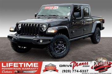 2023 Jeep Gladiator Willys 4x4 in a Granite Crystal Metallic Clear Coat exterior color and Blackinterior. Planet Chrysler Dodge Jeep Ram FIAT of Flagstaff (928) 569-5797 planetchryslerdodgejeepram.com 