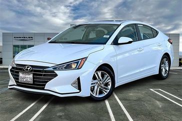 2019 Hyundai Elantra Limited in a White exterior color. Crystal Chrysler Jeep Dodge Ram (760) 507-2975 pixelmotiondemo.com 
