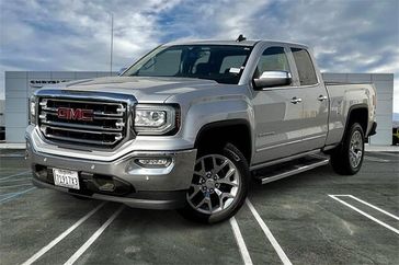 2018 GMC Sierra 1500 SLT in a Quicksilver Metallic exterior color and Jet Blackinterior. Crystal Chrysler Jeep Dodge Ram (760) 507-2975 pixelmotiondemo.com 