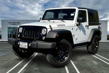 2017 Jeep Wrangler JK Willys Wheeler in a Bright White Clear Coat exterior color and Blackinterior. Crystal Chrysler Jeep Dodge Ram (760) 507-2975 pixelmotiondemo.com 