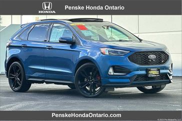 2020 Ford Edge ST in a Blue exterior color and Ebonyinterior. Ontario Auto Center ontarioautocenter.com 