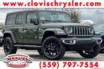 2024 Jeep Wrangler 4-door Sahara 4xe in a Sarge Green Clear Coat exterior color. Clovis Chrysler Dodge Jeep RAM 559-314-1399 clovischryslerdodgejeepram.com 