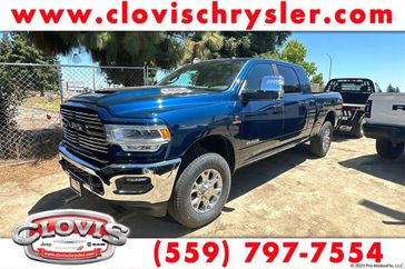 2023 RAM 3500 Laramie Mega Cab 4x4 6'4' Box in a Patriot Blue Pearl Coat exterior color and Blackinterior. Clovis Chrysler Dodge Jeep RAM 559-314-1399 clovischryslerdodgejeepram.com 