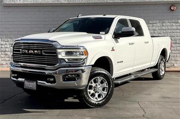 2020 RAM 2500 Laramie in a Bright White Clear Coat exterior color and Blackinterior. Crystal Chrysler Jeep Dodge Ram (760) 507-2975 pixelmotiondemo.com 