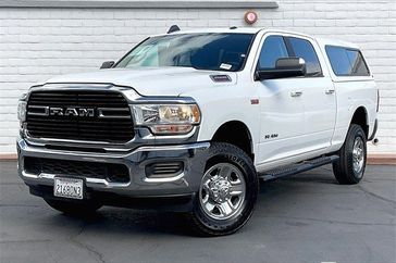 2019 RAM 2500 Big Horn in a Bright White Clear Coat exterior color and Blackinterior. Crystal Chrysler Jeep Dodge Ram (760) 507-2975 pixelmotiondemo.com 