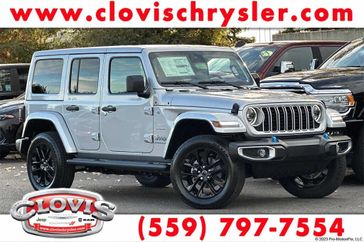 2024 Jeep Wrangler 4-door Sahara 4xe in a Silver Zynith Clear Coat exterior color and Blackinterior. Clovis Chrysler Dodge Jeep RAM 559-314-1399 clovischryslerdodgejeepram.com 