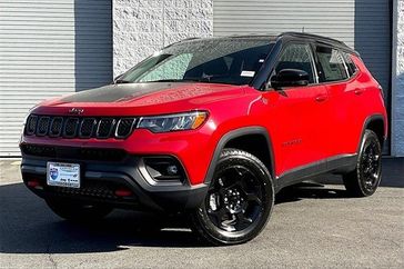 2023 Jeep Compass Trailhawk in a Redline Pearl Coat exterior color and Ruby Red/Blackinterior. I-10 Chrysler Dodge Jeep Ram (760) 565-5160 pixelmotiondemo.com 