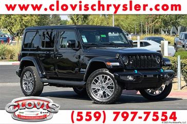 2024 Jeep Wrangler 4-door High Altitude 4xe in a Black Clear Coat exterior color and Green/Blackinterior. Clovis Chrysler Dodge Jeep RAM 559-314-1399 clovischryslerdodgejeepram.com 