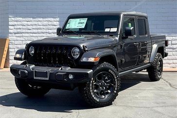 2023 Jeep Gladiator Willys 4x4 in a Granite Crystal Metallic Clear Coat exterior color and Blackinterior. Crystal Chrysler Jeep Dodge Ram (760) 507-2975 pixelmotiondemo.com 
