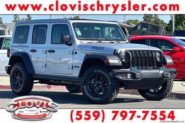 2023 Jeep Wrangler Willys 4xe in a Silver Zynith Clear Coat exterior color and Blackinterior. Clovis Chrysler Dodge Jeep RAM 559-314-1399 clovischryslerdodgejeepram.com 