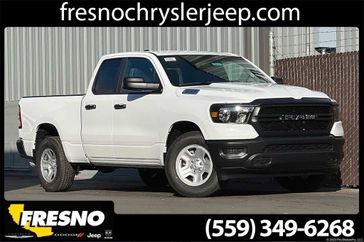 2024 RAM 1500 Tradesman Quad Cab 4x2 6'4' Box in a Bright White Clear Coat exterior color and Blackinterior. Fresno Chrysler Dodge Jeep RAM 559-206-5254 fresnochryslerjeep.com 