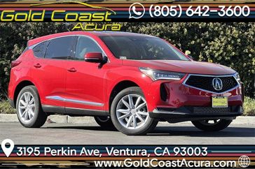 2024 Acura RDX Base in a Performance Red exterior color and Parchmentinterior. Ventura Auto Center 866-978-2178 venturaautocenter.com 