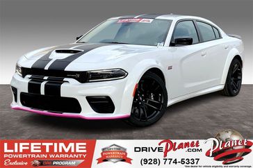 2023 Dodge Charger Scat Pack Widebody in a White Knuckle exterior color and Blackinterior. Planet Chrysler Dodge Jeep Ram FIAT of Flagstaff (928) 569-5797 planetchryslerdodgejeepram.com 