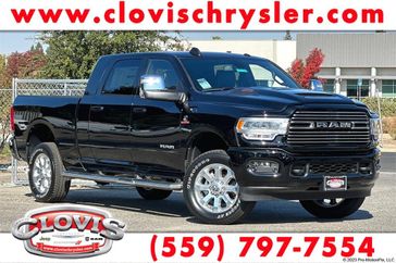 2024 RAM 2500 Laramie Mega Cab 4x4 6'4' Box in a Diamond Black Crystal Pearl Coat exterior color and Blackinterior. Clovis Chrysler Dodge Jeep RAM 559-314-1399 clovischryslerdodgejeepram.com 