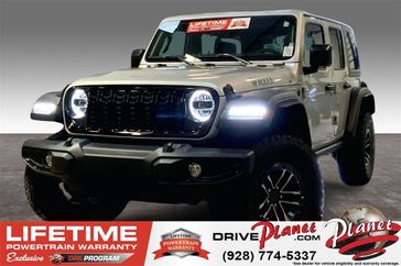 2024 Jeep Wrangler 4-door Willys in a Silver Zynith Clear Coat exterior color and Blackinterior. Planet Chrysler Dodge Jeep Ram FIAT of Flagstaff (928) 569-5797 planetchryslerdodgejeepram.com 