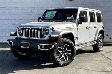 2024 Jeep Wrangler 4-door Sahara in a Silver Zynith Clear Coat exterior color and Blk Mckinley Trmmed Seatsinterior. Crystal Chrysler Jeep Dodge Ram (760) 507-2975 pixelmotiondemo.com 