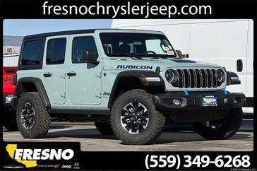 2024 Jeep Wrangler 4-door Rubicon 4xe in a Earl Clear Coat exterior color. Fresno Chrysler Dodge Jeep RAM 559-206-5254 fresnochryslerjeep.com 