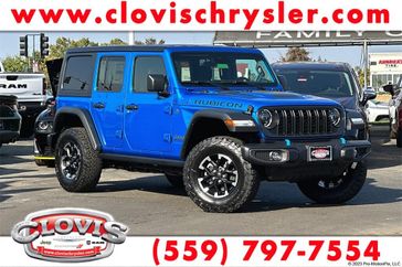 2024 Jeep Wrangler 4-door Rubicon 4xe in a Hydro Blue Pearl Coat exterior color and Blackinterior. Clovis Chrysler Dodge Jeep RAM 559-314-1399 clovischryslerdodgejeepram.com 